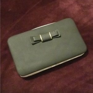 Lorna pidanlu designer wallet/wristlet.Black w/Bow on front and pink interior